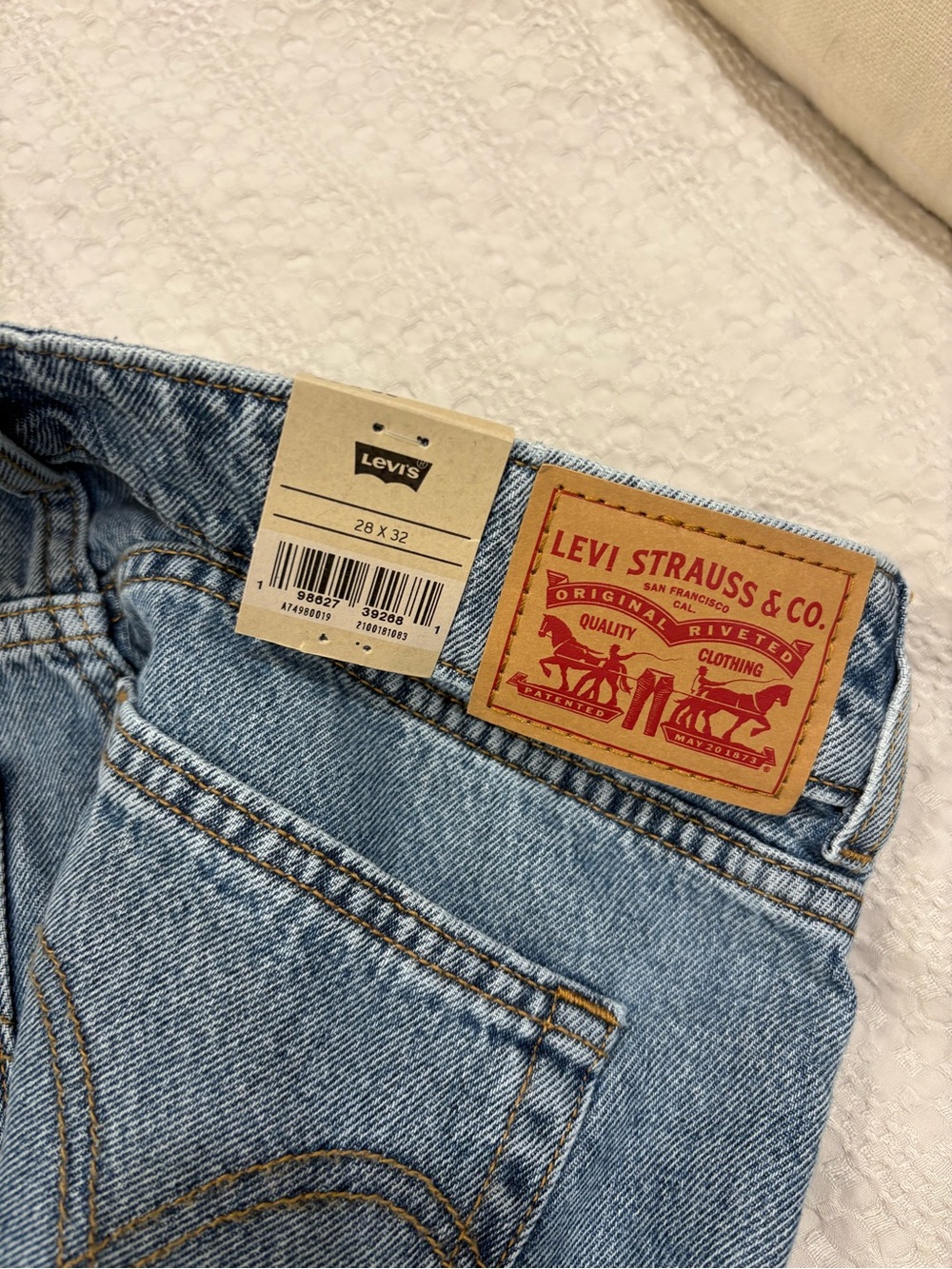 Levi's Light Blue Denim Jeans with Tan Leather Patch